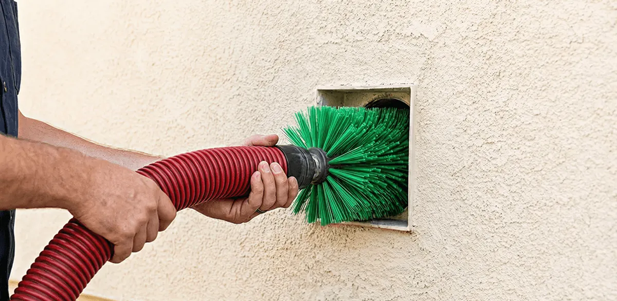 Air duct cleaning brush removing debris from a vent opening in San Diego, CA