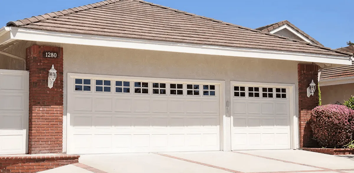 Residential garage door repair service for a double garage door in San Diego, CA