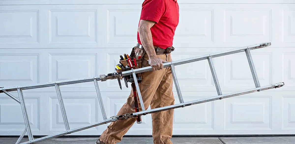 Garage door repair technician arriving with tools and ladder in San Diego, CA